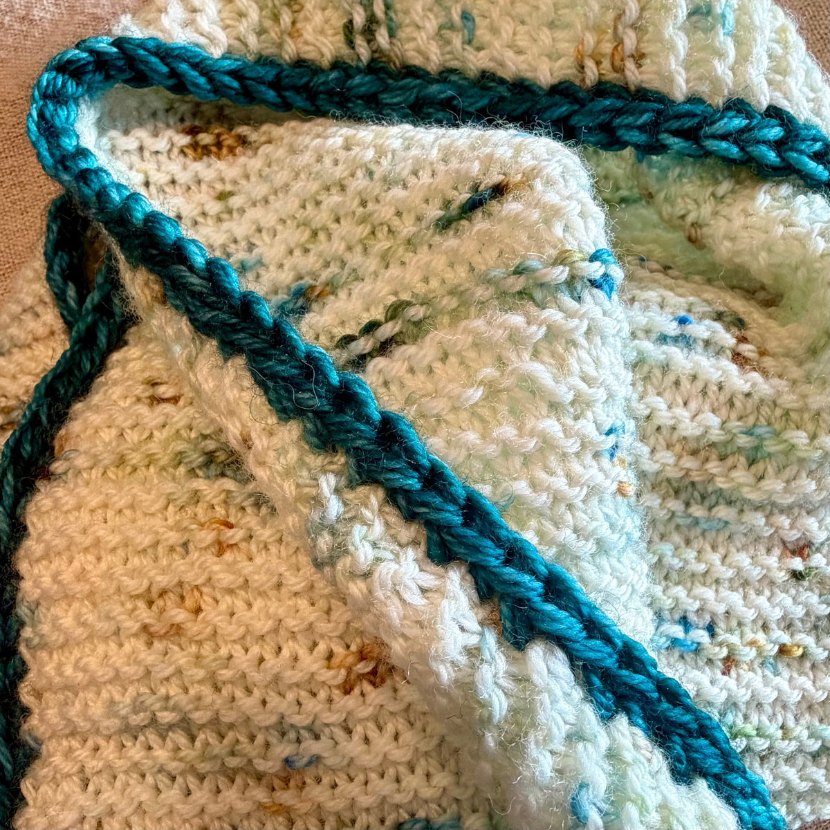 Applied I-cord edging on a handknit project from the Winter Express Holiday Movie Box